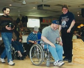  Veteran bowling in wheelchair on a lane