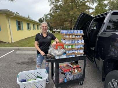 Erica with donation of food and drinks for Oldsmar cares food drive 