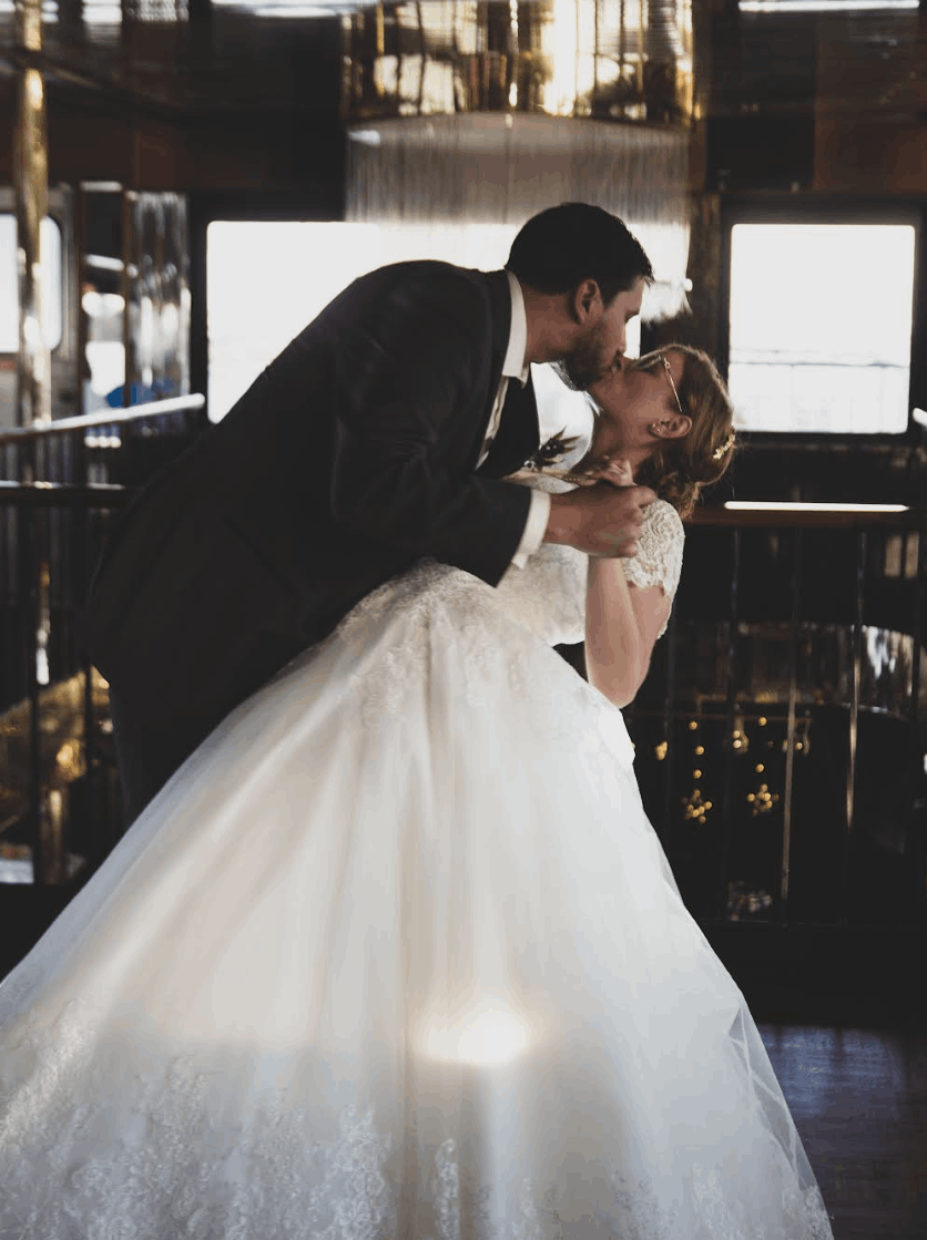 Ashley Jean Gorby wedding photo with husband kissing