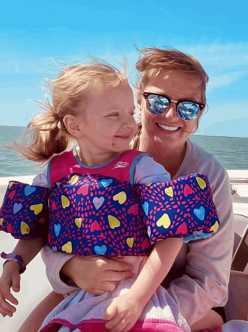 Ashley Jean  and her child  on the beach